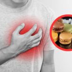 uomo con mano in petto e cibo spazzatura