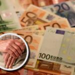 Mani di anziano su sfondo di euro