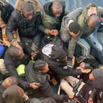 bambino nato su un barcone di migranti