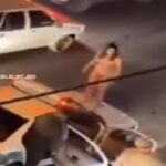 Donna nuda sull'auto della polizia in Iran