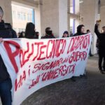 striscione studenti università torino contro tajani