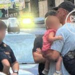 Francis Kaufmann con la bimba in braccio a roma