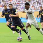 L'attaccante del Real Madrid Vinicius in azione contro la Juventus