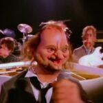 Un fotogramma del video di Land of Confusione dei Genesis, con i pupazzi animati che sono la caricatura dei membri della band