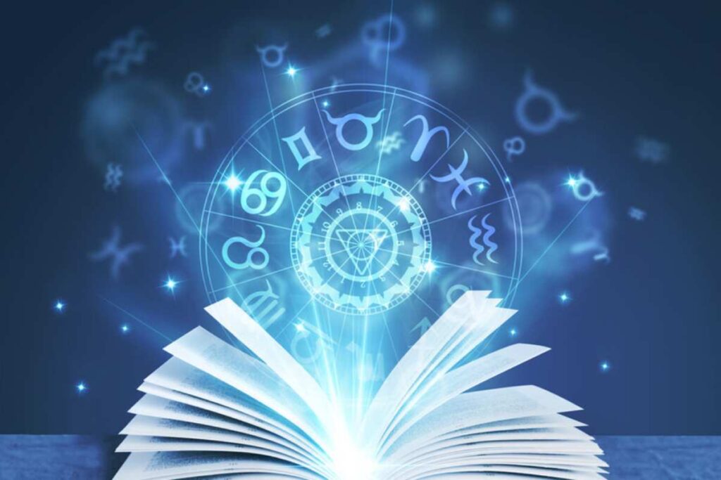 Immagine astratta di un libro con i segni zoadiacali su sfondo blu