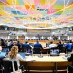 Consiglio ambiente Ue 2025 a Bruxelles.. Persone sedute ai tavoli in riunione