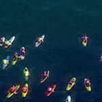 Surfisti omaggiano le vittime della strage di Bondi Beach