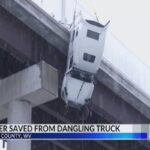 Il video dell'autista tratto in salvo dopo essere rimasto sospeso per ore con il suo camion su un ponte del West Virginia