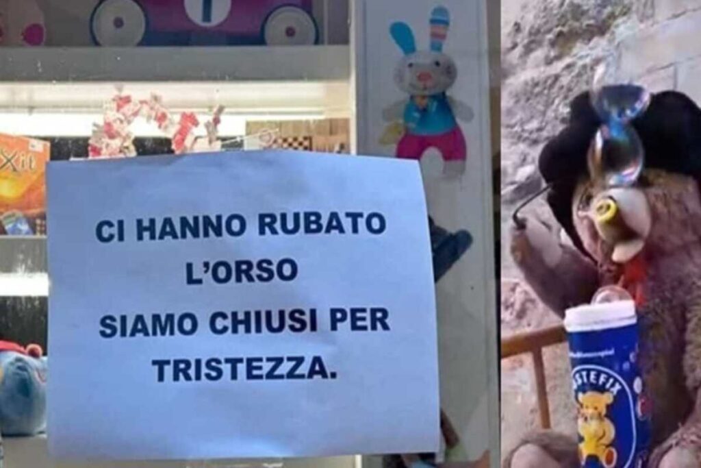 Cartello negozio e orsetto di peluche