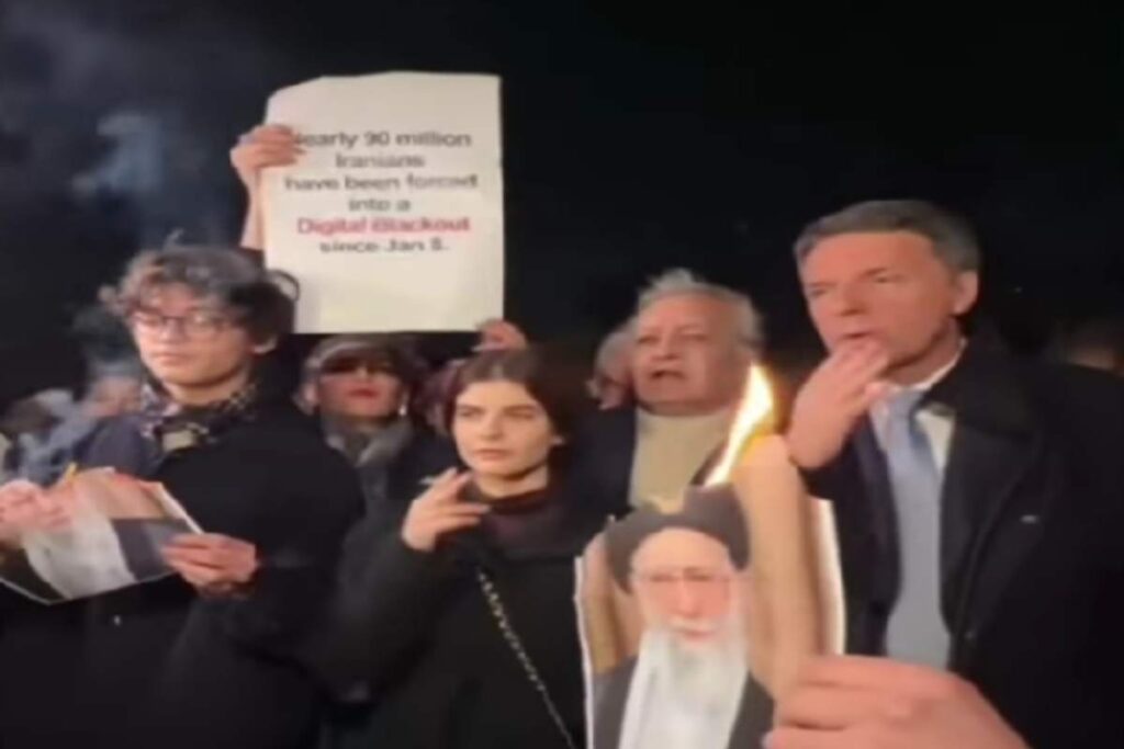 Renzi si accende una sigaretta con la foto in fiamme di Khamenei