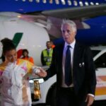 malagò con la fiamma olimpica