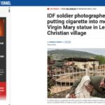 La foto del soldato israeliano che mette una sigaretta nella bocca della statua della Madonna