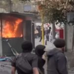 Cabina polizia in fiamme