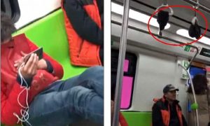 Pechino, mentre viaggia in metro appende i calzini puzzolenti 
