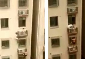 Cina, bambina intrappolata sulla facciata del palazzo: passanti si arrampicano e la salvano4