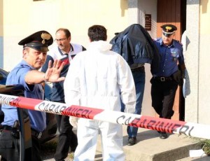 Gilberti viene portato via dai carabinieri  dopo il delitto (foto Ansa)
